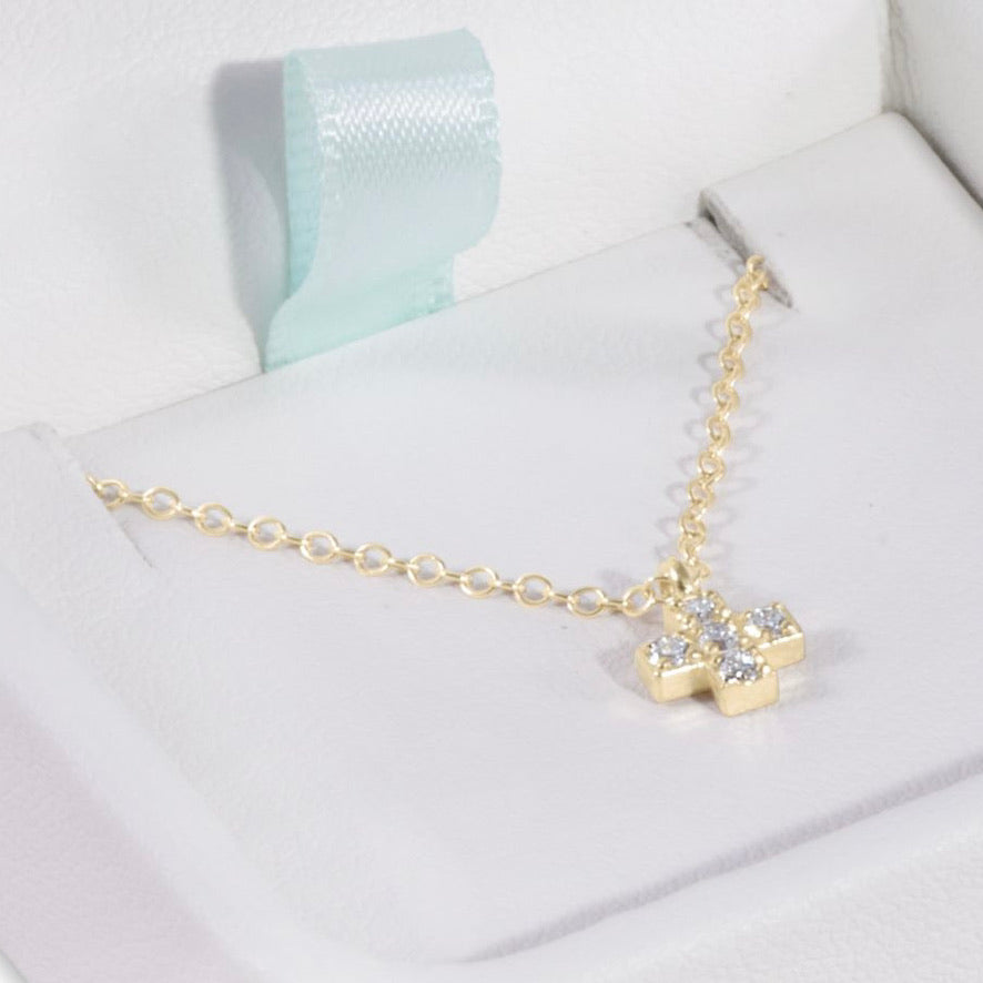 Elsa Peretti® cross pendant in 18k gold, 12 mm wide. | Tiffany & Co.